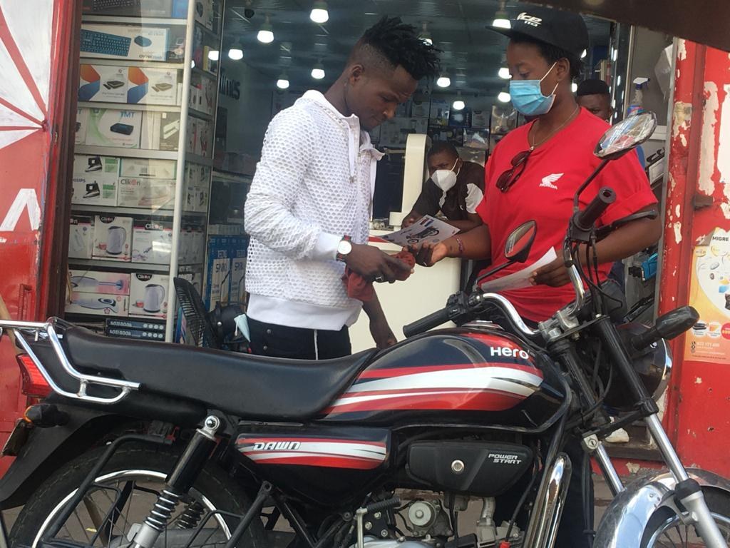 Promotional team engaging a customer during a street activation