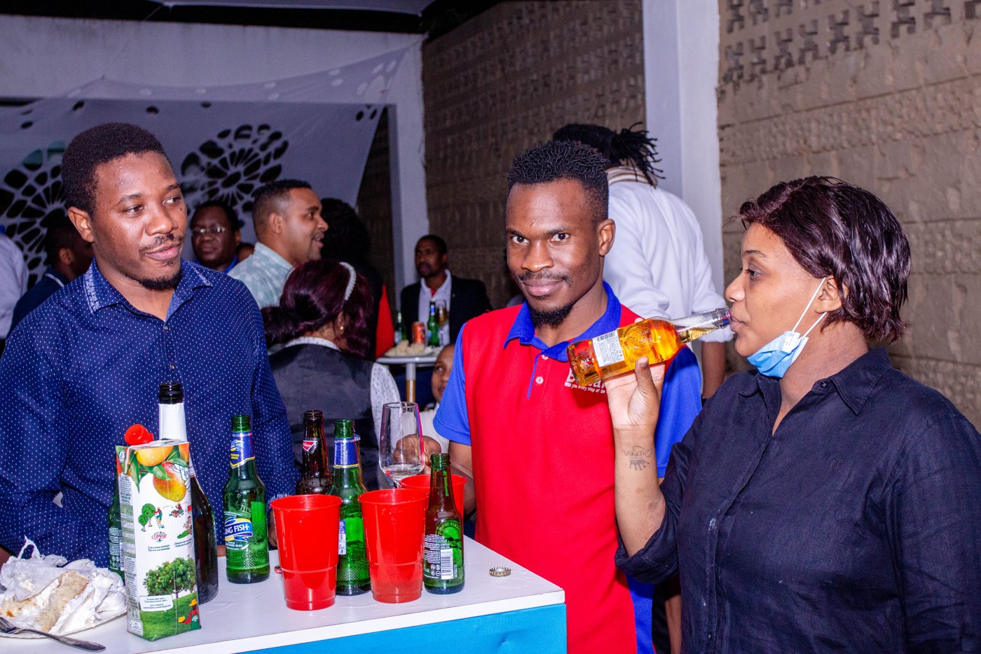 Guests talking at a cocktail table during a Britam event